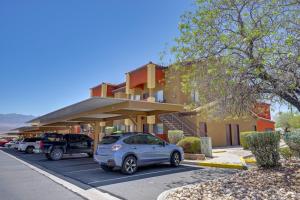 a car parked in a parking lot in front of a building at Golf & Gamble! Mesquite Condo w/ Pool Access in Mesquite