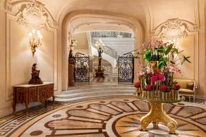 a lobby with a table with flowers on it at Shangri-La Paris in Paris +111 photos