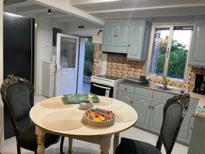 a kitchen with a table with a bowl of food on it at Chalikas Vintage Cottage in Mytilene