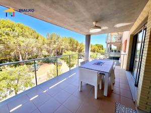 a balcony with a table and a view at Alcocebre suites INALKO in Alcalà de Xivert