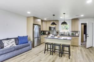 a kitchen and living room with a couch and a table at Steinhatchee River Hideaway, 1 Mi to the Water! in Steinhatchee