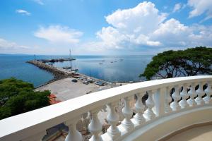 a balcony with a view of the water at Family Hotel Paros in Pomorie