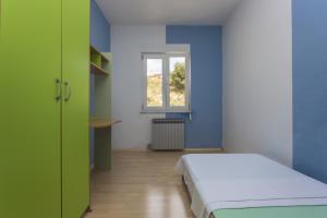 Posteľ alebo postele v izbe v ubytovaní Gospodar Apartments