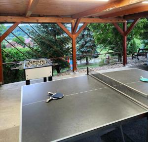 a ping pong table in a pavilion with a tennis court at Villa Spa Magic in Tuheljske Toplice