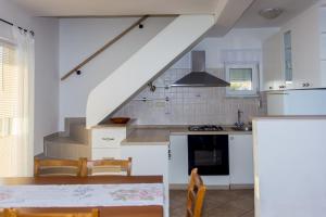 Kuchyňa alebo kuchynka v ubytovaní Gospodar Apartments