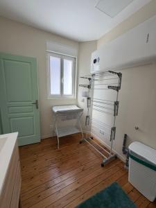 an empty room with a treadmill and a window at Le refuge de Notre-Dame in Berck-sur-Mer