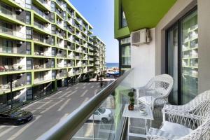 a balcony with a view of a building at Bavaro 50 by Alezzi Resort in Mamaia Sat/Năvodari