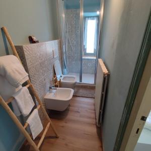 a bathroom with a toilet and a sink and a shower at Charme a Corniglio - Suite Cervo in Corniglio +23 photos