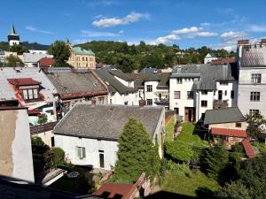 an aerial view of a town with houses and trees at Ayni Apartment Semily in Bohemian Paradise in Semily