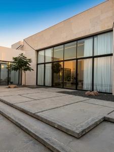 a building with large glass windows on the side of it at Hummingbird Dubai in Dubai