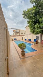 a swimming pool in the middle of a building at Kipress Lodge Hôtel in Ouagadougou