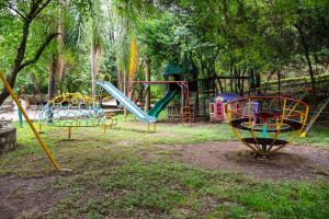 a playground with different colored slides in a park at Campestre La Fuente in Monterrey