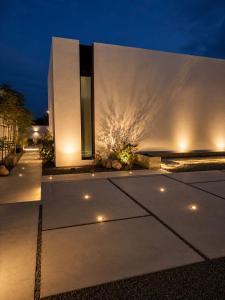 a house with lights on the side of it at Hummingbird Dubai in Dubai
