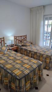 a room with three beds in a room at Duplex Los Chanchez in Aguadulce +23 photos
