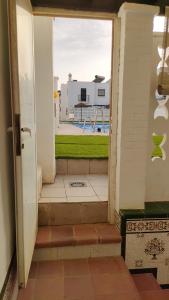 an open door with a view of a playground at Duplex Los Chanchez in Aguadulce