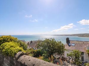 a view of the ocean from a city at Arosfa in New Quay