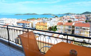 a balcony with a view of a city at Thalia Sea View Apartment in Nea Peramos