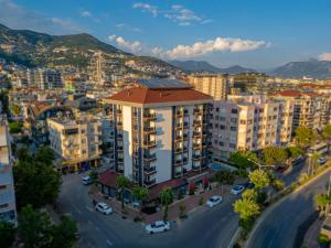 an aerial view of a city with buildings at Kleopatra Micador Otel in Alanya