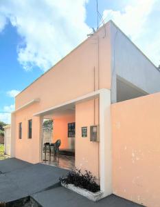 a house with an open door and a patio at Casa Inteira com Garagem, no Goiabal até 3 hospedes in Macapá