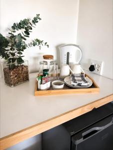 a kitchen counter with a tray of food on it at Camperdown Stay in Camperdown