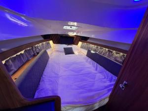 a small bed in the back of a boat at Golden Yacht Solina in Polańczyk