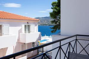 a balcony with a view of the water at Hara's Studio in Perdika