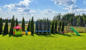 a playground with a play set and a slide at Chata z Pary in Prącki