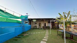 a house with a garden in front of it at Gravity Groups Core - La Maison Villa in Pondicherry