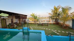 a swimming pool in front of a building at Gravity Groups Core - La Maison Villa in Pondicherry