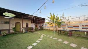 a yard with a ping pong table and a building at Gravity Groups Core - La Maison Villa in Pondicherry