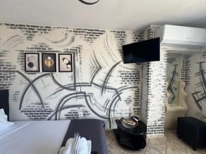 a bedroom with a bed and a wall mural at Downtown Hub 1 in Alexandroupoli