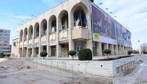 a large building with a large billboard in front of it at Casa de Cultura house in Constanţa
