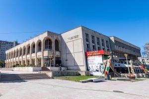 a large building in the middle of a city at Casa de Cultura house in Constanţa
