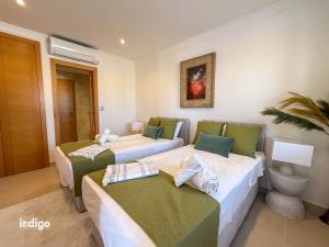 a hotel room with two beds at Villa Nichan - Private Pool - NIC01 in Ayamonte +26 photos