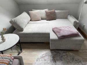 a living room with a couch and a table at Mein kleines Reich in Zwickau