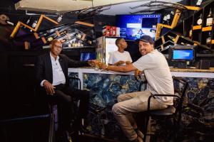 a group of three men sitting around a bar at Poolside View Guest House in Kigali +56 photos