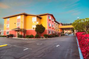 an empty street with a row of colorful buildings at Bay City Inn in Bellingham