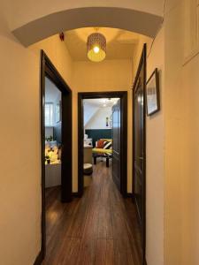 a hallway with a hallway leading to a living room at The Recharge Loft in Durham
