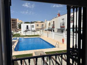 a view of a swimming pool from a balcony at Duplex Los Chanchez in Aguadulce