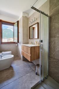 a bathroom with a tub and a sink and a shower at Meridiana Gemona in Taboga +24 photos