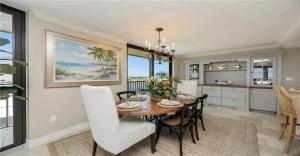 a dining room with a table and chairs at Oceanview Serenity Escape in Naples