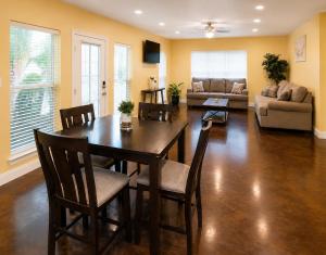 a living room with a table and chairs and a couch at Ground Floor, 3BR, Free Parking, Near Refinery -E- in Moss Point
