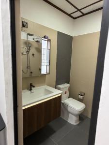 a bathroom with a toilet and a sink at Hill Nest Ella in Bandarawela +5 photos