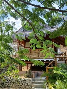 a resort with stairs leading up to a building at Finca Paraiso retiros holisticos in San Clemente