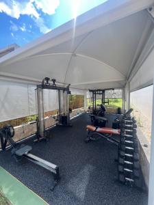 a white tent with exercise equipment inside of it at Hotel Joel in Novalja +107 photos