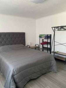 a bedroom with a large bed in a room at Lajes guests house in Lajes