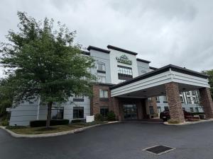 a hotel building with a parking lot in front of it at Wingate by Wyndham Harrisburg Near Hershey in Harrisburg