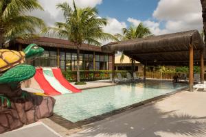 a resort with a swimming pool with a resort at Vila Galé Resort Cumbuco - All inclusive in Cumbuco