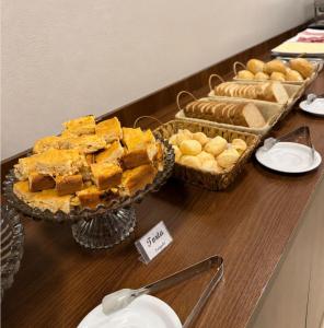 a buffet with various types of bread and pastries at Rosa's Hotel in Toledo +38 photos