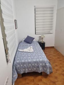 a bedroom with a bed with two towels on it at Appartement Cambrils in Cambrils